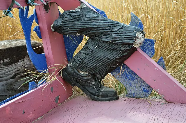 Remains of a parade float in tall grass